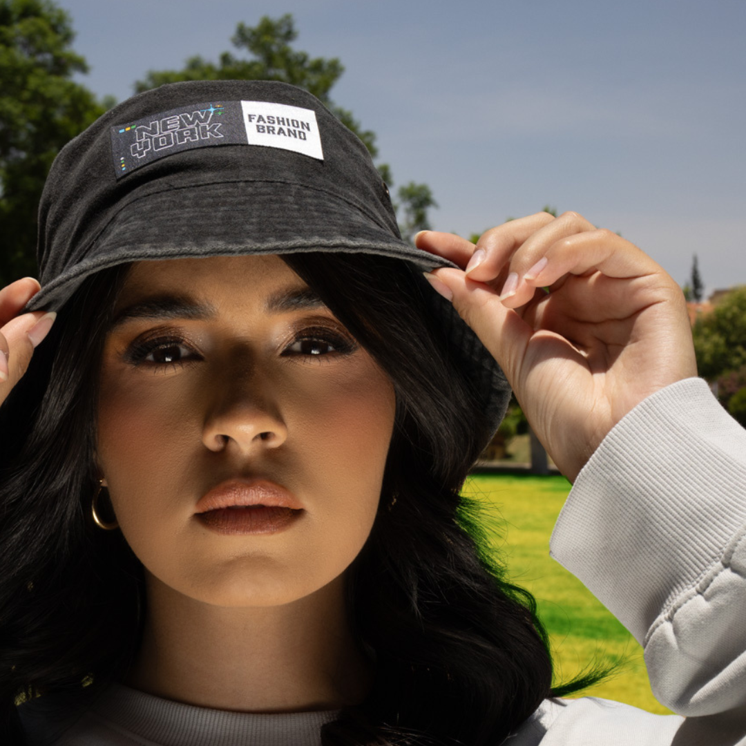 woman wearing hat with heat applied patch