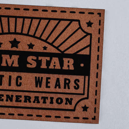 Chestnut and Black Faux Leather Denim Star patch close up