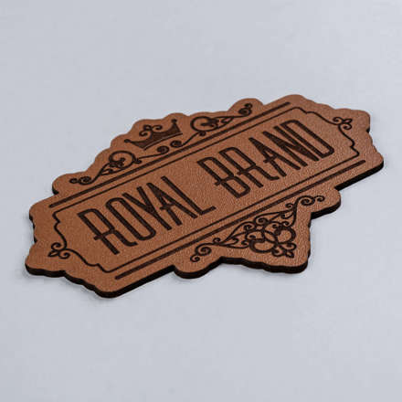 Caramel Genuine Leather with high contrast royal brand patch laid at a hard angle