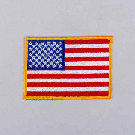 Embroidered American Flag Patch with yellow border laid flat