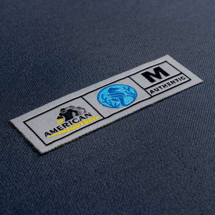 Woven Authenticity tag laid at a hard angle